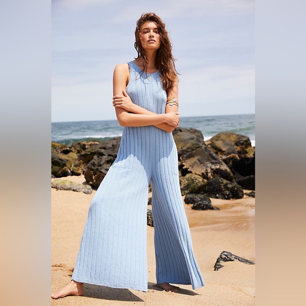 Blue, key hole back (photo in white) button . 56” from shoulder to pant bottom